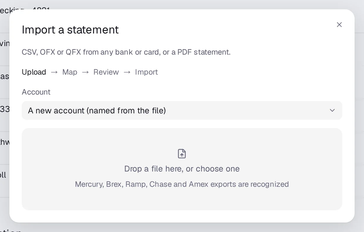 The Import a statement dialog, mapping a CSV's date, description and amount columns